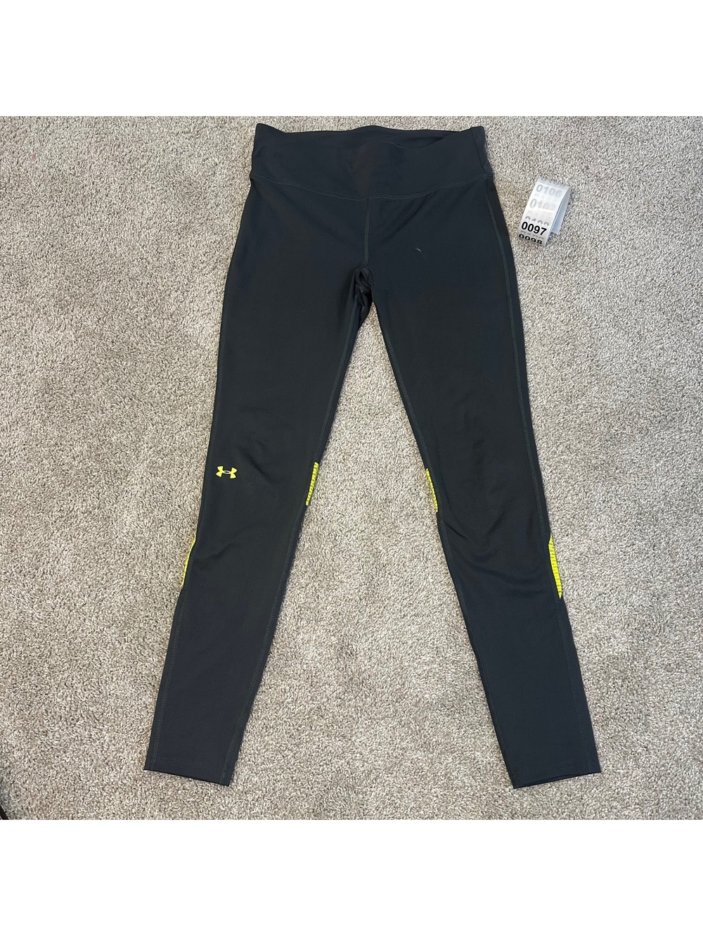 Under Armour black leggings with neon yellow accents